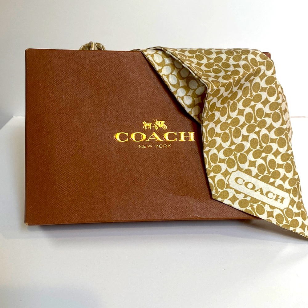 Beautiful coach scarf. Gently used as a purse accessory.